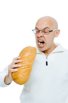 Bald man biting a loaf. Isolated on white