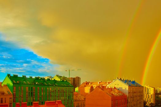 Double rainbow over bright colored houses. Kiev city