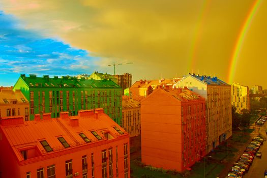 Double rainbow over bright colored houses. Kiev city