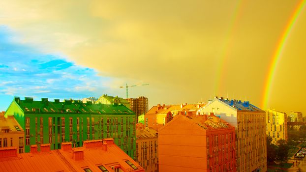 Double rainbow over bright colored houses. Kiev city