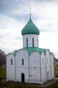 White orthodox church with green dome
