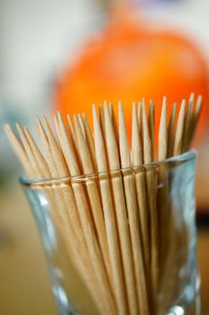 Group of wooden toothpicks in a glass