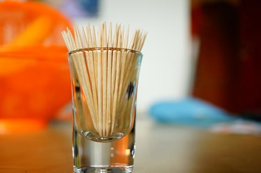 Group of wooden toothpicks in a glass