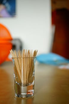 Group of wooden toothpicks in a glass