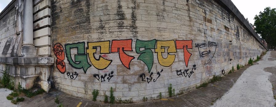Mural of graffiti on a brick wall in Lyon, France