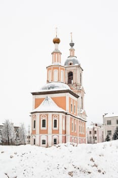 White and yellow-pink church in winter in Uglich
