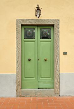 Door entrance and stone wall on old building in Ragusa, Sicily