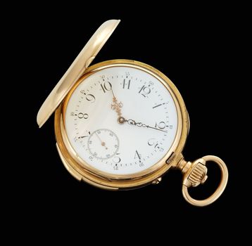 Vintage pocket watch isolated on black.