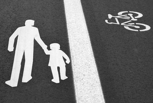 Bike lane. Sign for bicycle painted on the asphalt.