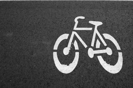 Bike lane. Sign for bicycle painted on the asphalt.