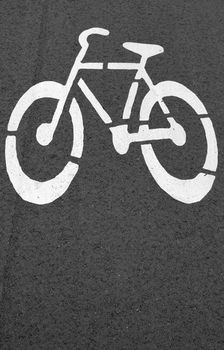 Bike lane. Sign for bicycle painted on the asphalt.