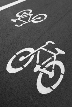 Bike lane. Sign for bicycle painted on the asphalt.