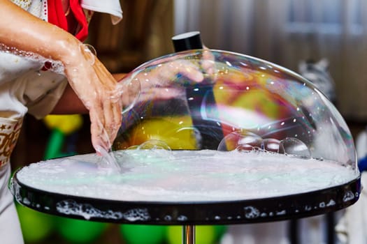 Big soap bubble on a children's holiday                               