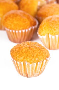 Delicious mini banana muffins on a white background