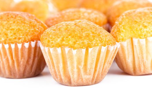 Delicious mini banana muffins on a white background