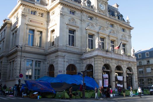 FRANCE, Paris: A refugee camp is installed in front of the city hall of the 18th arrondissement in Paris, on September, 15, 2015. Almost hundred and fifty refugees from South Soudan and Eritrea camp in front of the city hall of the 18th arrondissement in Paris since September, 4, 2015. Paris mayor Anne Hidalgo announced on September, 15, 2015 giving them a place in one of the seven installations opened in the capital and around las week. 