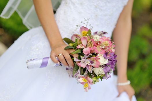 Bride with wedding  bouquet, closeup