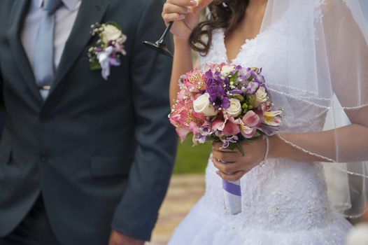 wedding bouquet in hands of the bride