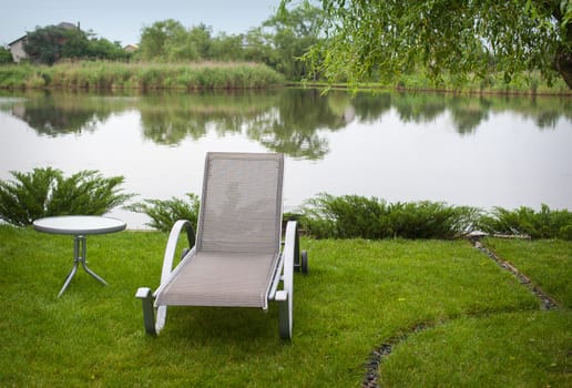 Sun lounger on the lake