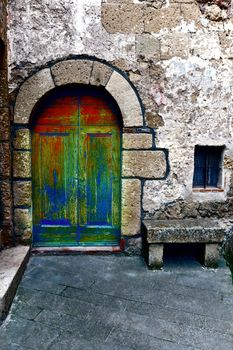 Wooden Ancient Italian Door in Historic Center, Vintage Style Toned Picture