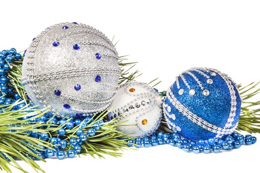 Christmas tree branch and blue with white glitter balls isolated