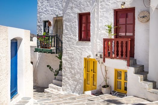 Scenic view of colorful street in traditional Greek cycladic village Plaka, Milos island, Greece
