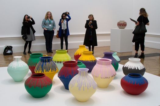 UK, London: Painted vases by Chinese artist Ai Weiwei, in his new exhibition at the Royal Academy in London, on September 15, 2015. 	The show opens to the public on September 19 and has been hailed by critics as his best ever exhbition. Works include a six-part diorama called 'Sacred' depicting his arrest, painted vases, and a security camera made from marble.