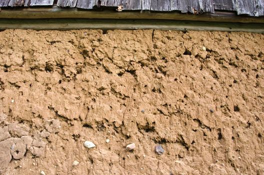 Detail of historical old house made of clay