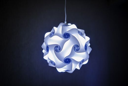 Modern designer lamp in blue light