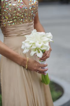 Bride hold her calla wedding bouquet 