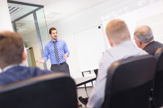 Business man making a presentation in office on job interview. Business presentation on corporate meeting. Recruiters evaluating the candidate. 