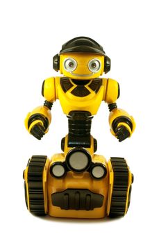 Children's toys - yellow robot on caterpillar wheels isolated on a white background