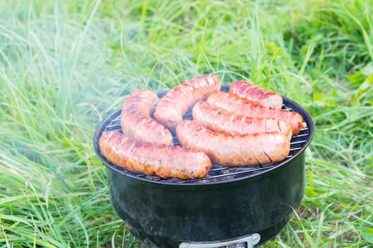 Polish sausages on a grill