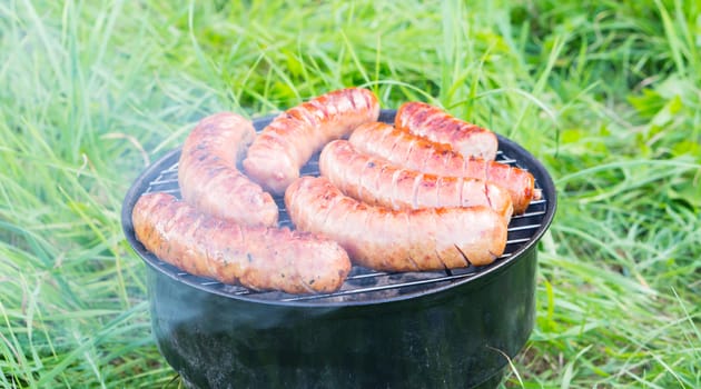 Polish sausages on a grill