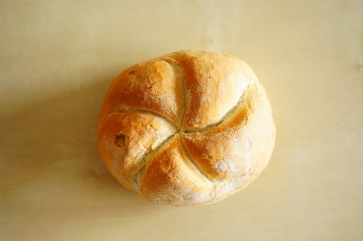 Whole bread on wooden background