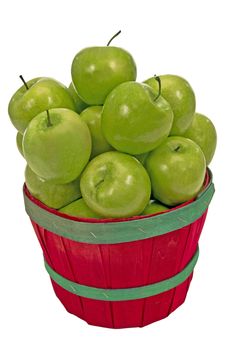 Close up shot of a small basket overloaded with fresh picked green apples on a white background.