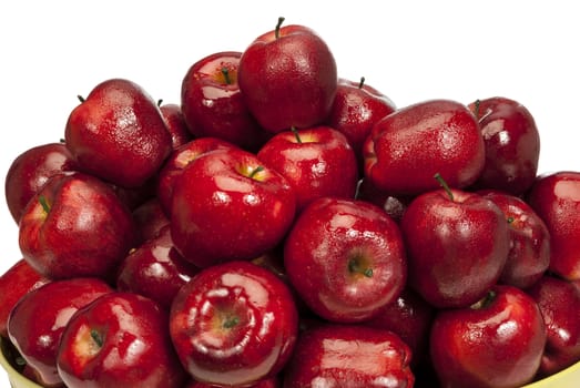 Close up shot of wet and juicy fresh red apples with lots of copy space above on white background