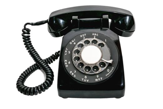 Vintage black rotary dial telephone on a white background