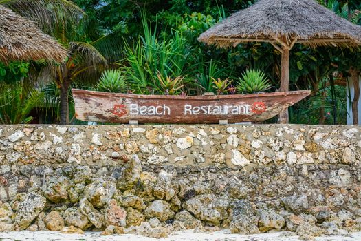 beach restaurant sign in Zanzibar,Tanzania.