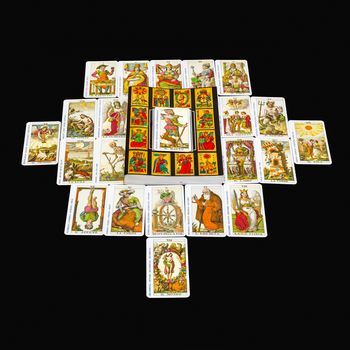 the book of the Tarot and all 22 Major Arcana,with foreground "The Fool" card.