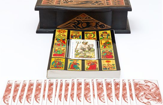 the book of the Tarot , with foreground "The Devil" card.