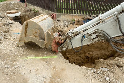 excavator ploughshare on trench - constructing canalization in european project - wastewater treatment plant, ecology project
