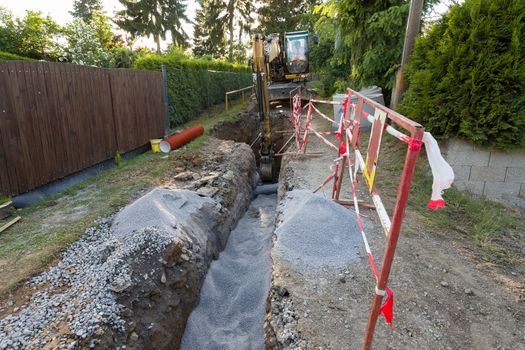 excavator on trench - constructing canalization in european project - wastewater treatment plant, ecology project