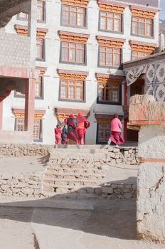 closed up the lamas are running to the class in Leh, India