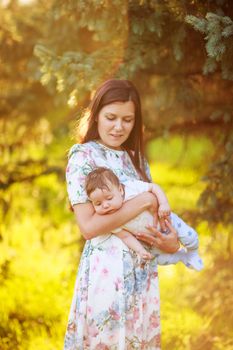 Mother with baby son, close-up, summer photos outdoor