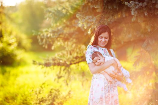 Mother with baby son, close-up, summer photos outdoor