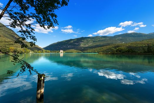 Toblino Lake (Lago di Toblino) with a medieval castle, small alpine lake in Trentino Alto Adige, Italy, Europe