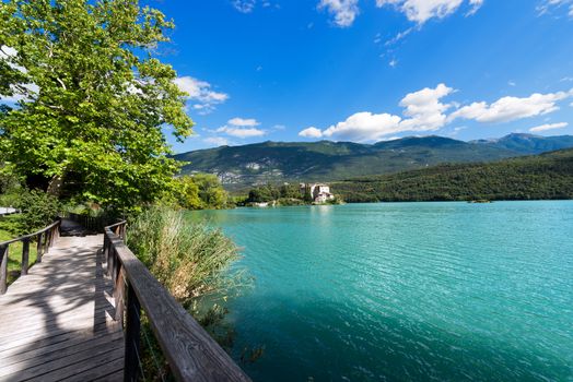 Toblino Lake (Lago di Toblino) with a medieval castle, small alpine lake in Trentino Alto Adige, Italy, Europe