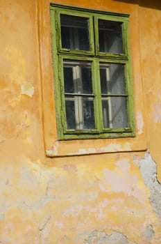 Vintage green window with yellow background