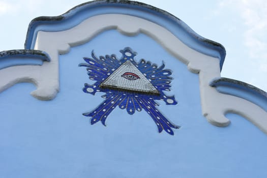Evil eye detail from blue church Bratislava Slovakia